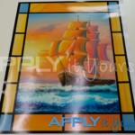 Stained glass window design on transparent window film with a painting of a ship / boat in the middle