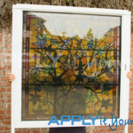 transparent window film with classic stained glass design in yellow, red, green