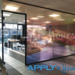 transparent window film with large aerial photo on an office glass wall