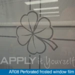 Perforated frosted window film with a custom printed design, close-up, back-side