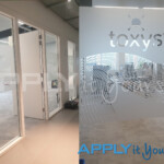 frosted window film project for multiple office panels with complex logos branding apply it yourself